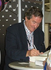 Head-and-shoulders photo of Spanish author J.J. Benitez, a gray-bearded man in glasses.