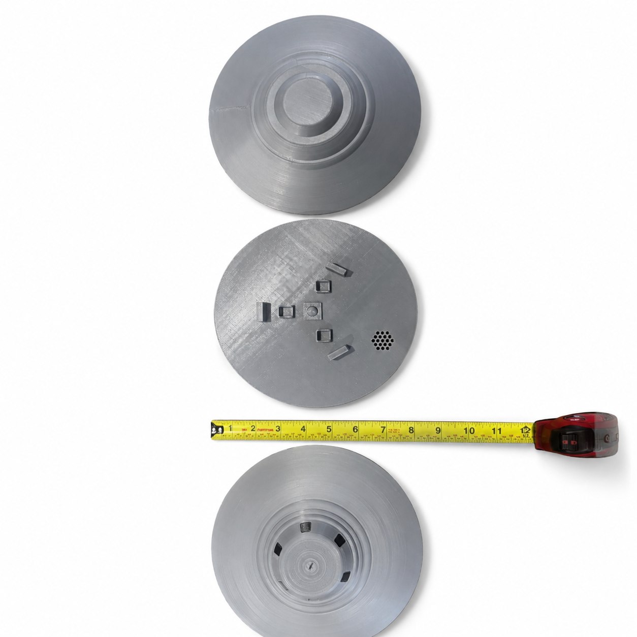 Top, interior, and bottom views next to a tape measure showing the model's true 10-inch size